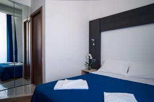 Postel nebo postele na pokoji v ubytování Hotel Louisiana