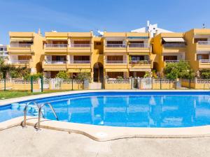 a swimming pool in front of a building at Apartament Francesca Beach with Pool in Alcudia
