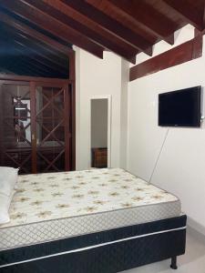 Postelja oz. postelje v sobi nastanitve Apartamento completo perto da Praia de Maresias
