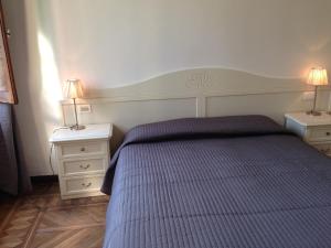 A bed or beds in a room at Corte Loredana