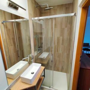 a bathroom with a white sink and a shower at Moka in Grzybowo +34 photos