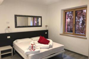 Ένα ή περισσότερα κρεβάτια σε δωμάτιο στο Villa Teresa - Appartamenti con vista lago