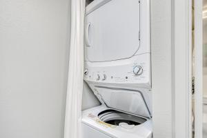 a washer and dryer sitting inside of a refrigerator at Kahana Villa E610 in Kahana