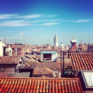 a view of a city with roofs of buildings at Lion Rooftop Apartments Venice NOVITA' in Venice