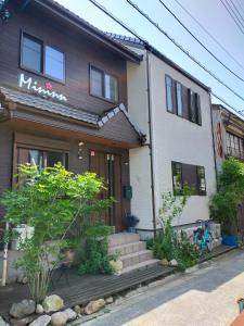 a house with a staircase in front of it at Mini inn Nara- - 外国人向け - 日本人予約不可 in Nara