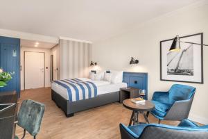 Ένα ή περισσότερα κρεβάτια σε δωμάτιο στο Hotel Yachtclub