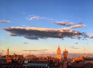 a view of a city skyline with a cloudy sky at Lion Rooftop Apartments Venice NOVITA' in Venice