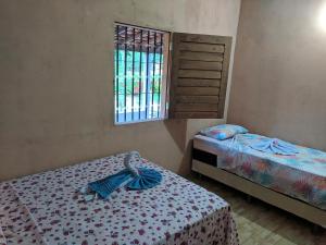 Krevet ili kreveti u jedinici u okviru objekta Chalé Cantinho Meu
