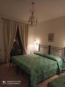 Säng eller sängar i ett rum på Agriturismo Oasi del Pianettino