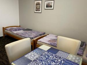 A bed or beds in a room at Četnická stanice Hluboká