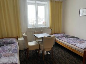 A bed or beds in a room at Četnická stanice Hluboká