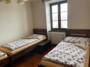 A bed or beds in a room at Četnická stanice Hluboká