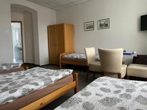 A bed or beds in a room at Četnická stanice Hluboká
