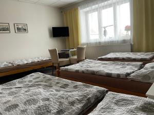 A bed or beds in a room at Četnická stanice Hluboká
