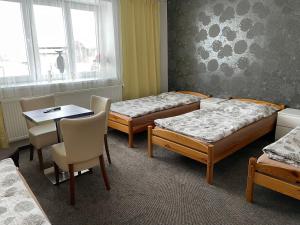 A bed or beds in a room at Četnická stanice Hluboká