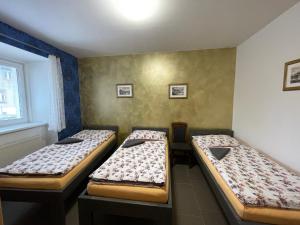 A bed or beds in a room at Četnická stanice Hluboká