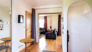 a view of a living room from the hallway at La Découverte, Jacuzzi, Sauna, et Terrasse avec vue sur lac à la campagne entre Toulouse et Auch in Catonvielle