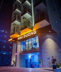 a hotel building with a sign that reads hilounge at Hai Duong Vung Tau Hotel - Khách sạn Hải Dương Vũng Tàu in Vung Tau
