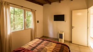 a bedroom with a bed and a window at NomeolvidesMás in Tandil +33 photos