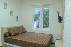 Ένα ή περισσότερα κρεβάτια σε δωμάτιο στο CASAKITA exclusive guest house