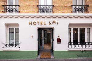 a hotel entrance with a door in a building at H&ocirc;tel AMI - Orso Hotels in Paris