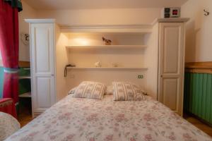 Postel nebo postele na pokoji v ubytování Hotel Della Nouva