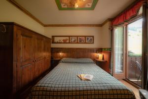 Postel nebo postele na pokoji v ubytování Hotel Della Nouva