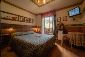 Postel nebo postele na pokoji v ubytování Hotel Della Nouva