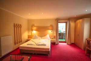 Cama o camas de una habitación en Hotel Cornelia
