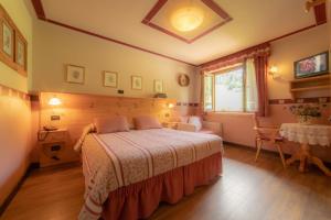 Postel nebo postele na pokoji v ubytování Hotel Della Nouva
