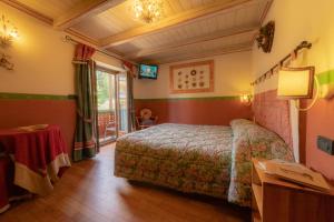 Postel nebo postele na pokoji v ubytování Hotel Della Nouva
