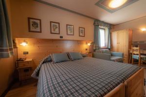 Postel nebo postele na pokoji v ubytování Hotel Della Nouva