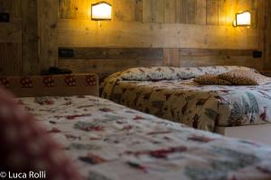 Postel nebo postele na pokoji v ubytování Hotel Della Nouva