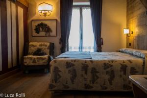 Postel nebo postele na pokoji v ubytování Hotel Della Nouva