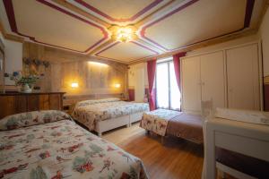 Postel nebo postele na pokoji v ubytování Hotel Della Nouva
