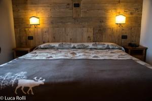Postel nebo postele na pokoji v ubytování Hotel Della Nouva