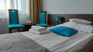 Postel nebo postele na pokoji v ubytování Hotel IKAR