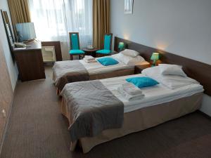 Postel nebo postele na pokoji v ubytování Hotel IKAR + 33 fotografií