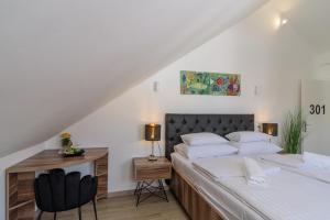 מיטה או מיטות בחדר ב-Hotel Vila White