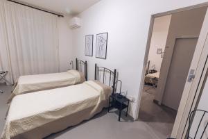 Postel nebo postele na pokoji v ubytování LOCANDA Roma sleep & food