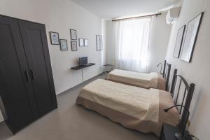 Postel nebo postele na pokoji v ubytování LOCANDA Roma sleep & food