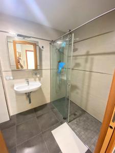 a bathroom with a shower and a sink at APARTAMENTO JMHR 4 in Benajarafe +17 photos