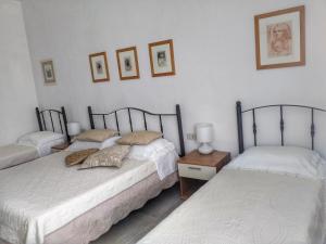 Postel nebo postele na pokoji v ubytování LOCANDA Roma sleep & food
