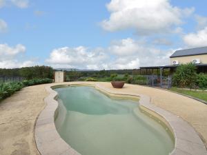 a swimming pool in the middle of a yard at Kelman Cottage with pool and beautiful native wildlife in Belford