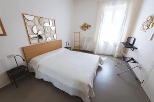 Postel nebo postele na pokoji v ubytování LOCANDA Roma sleep & food