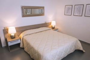 Postel nebo postele na pokoji v ubytování LOCANDA Roma sleep & food