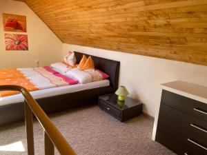 Posteľ alebo postele v izbe v ubytovaní Arany Apartman