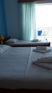 Odhisea Hotel Restaurantにあるベッド