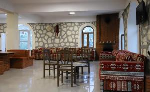 a waiting room with chairs and a table in a building at Hotel Euphrat Nemrut in Karadut
