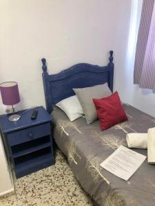 A bed or beds in a room at Pensión Playa